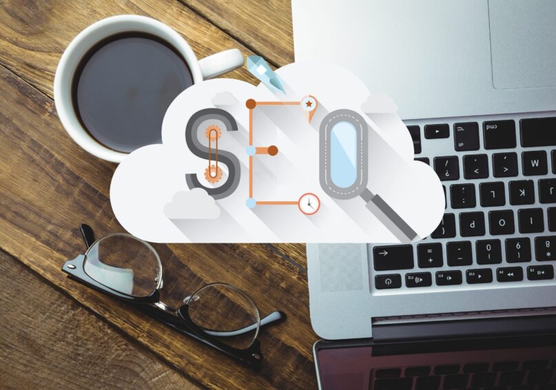 digital composite of coffee with laptop and SEO graphics